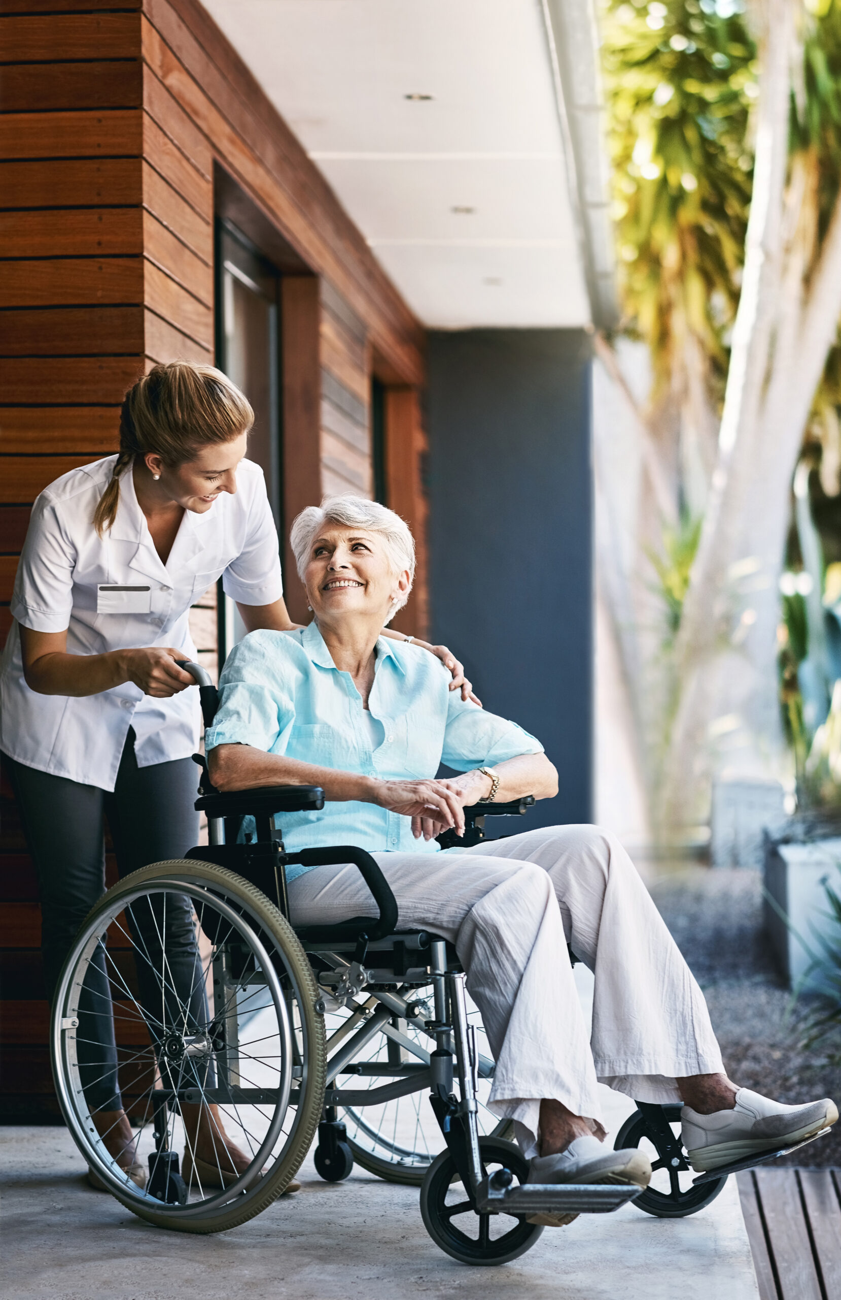 Caregiver help and care Asian senior or elderly old lady woman patient sitting on wheelchair to ramp in nursing hospital, healthy strong medical concept.